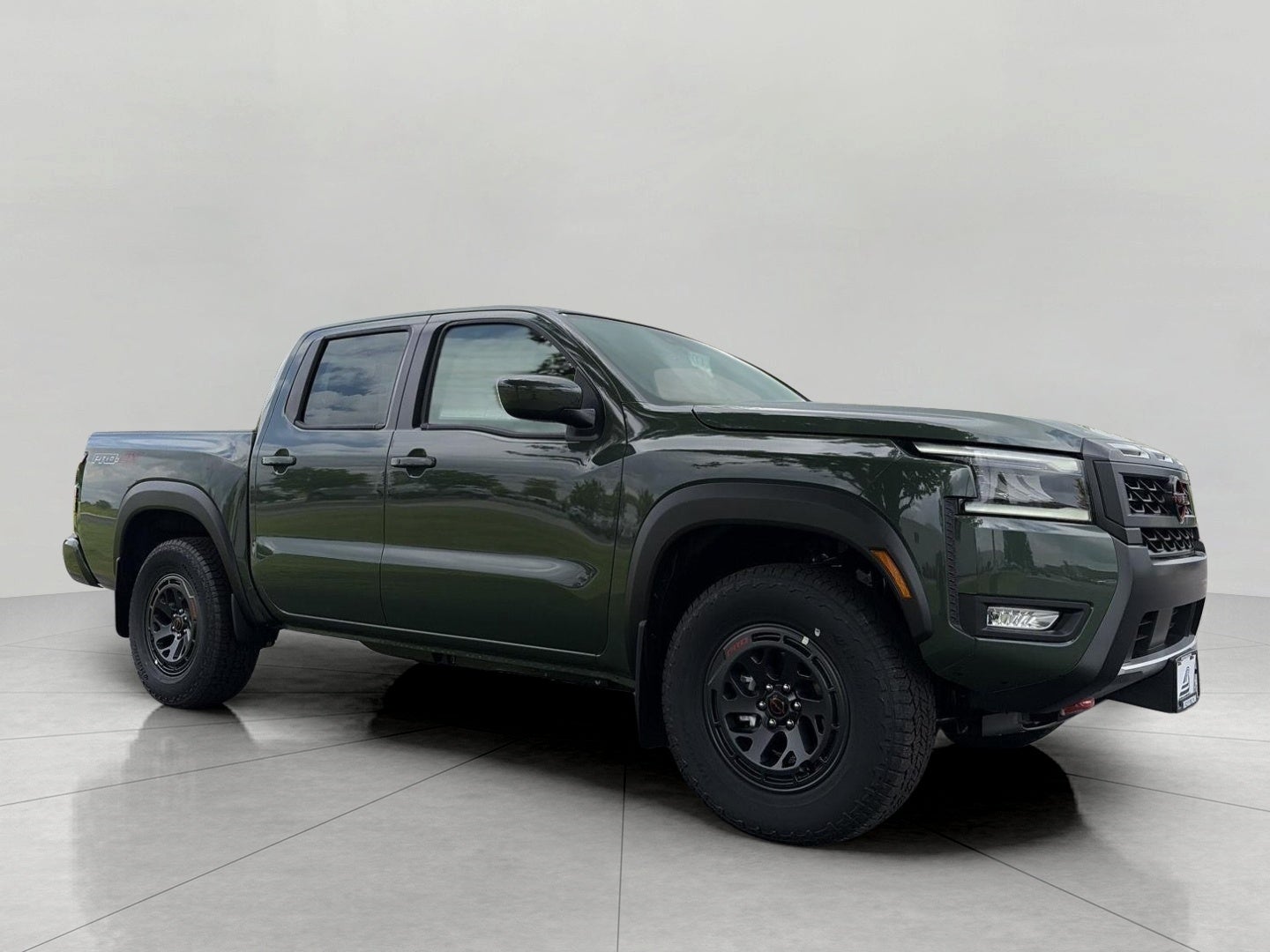 2026 Nissan Frontier Crew Cab 4x4 PRO-4X in Tactical Green Metallic — front three-quarter view