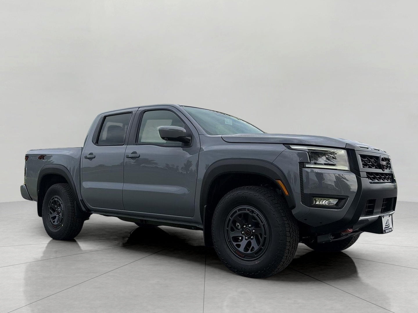 2026 Nissan Frontier Crew Cab 4x4 PRO-4X in Boulder Gray Pearl — front three-quarter view