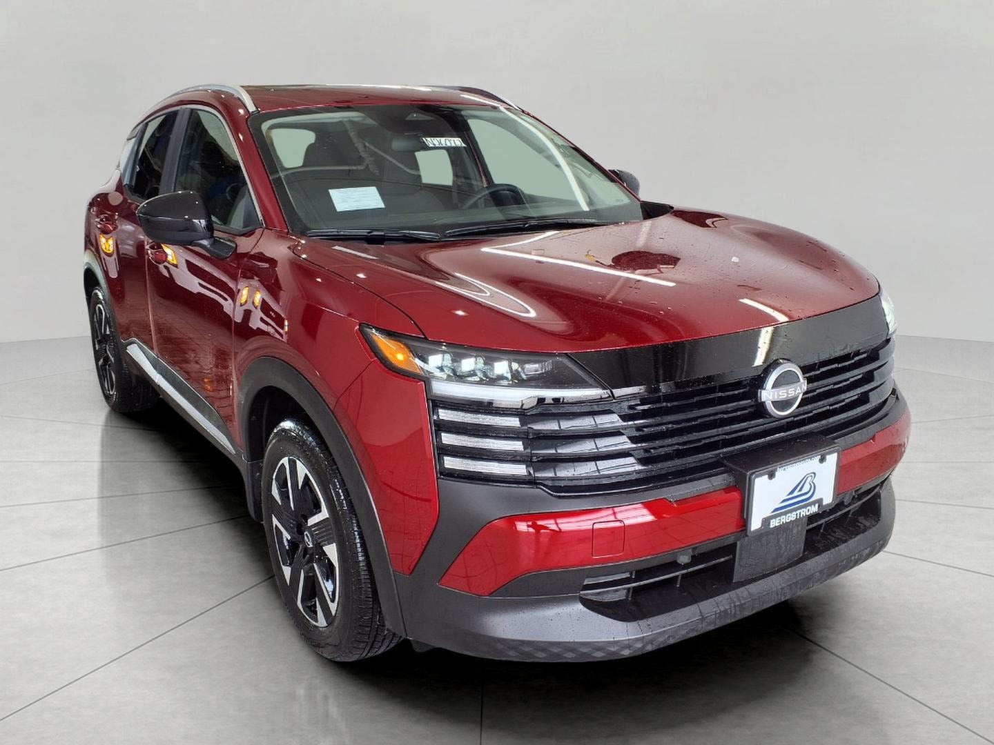 2026 Nissan Kicks SV AWD in Scarlet Ember Tintcoat — front three-quarter view