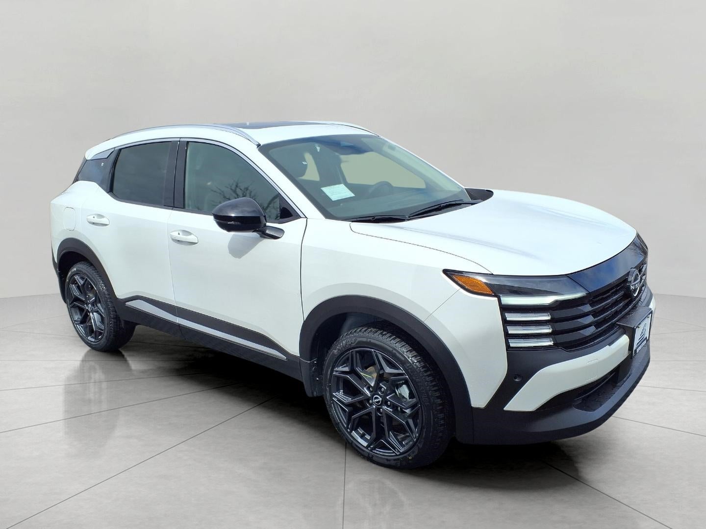 2026 Nissan Kicks SR AWD in Aspen White Tricoat — front three-quarter view