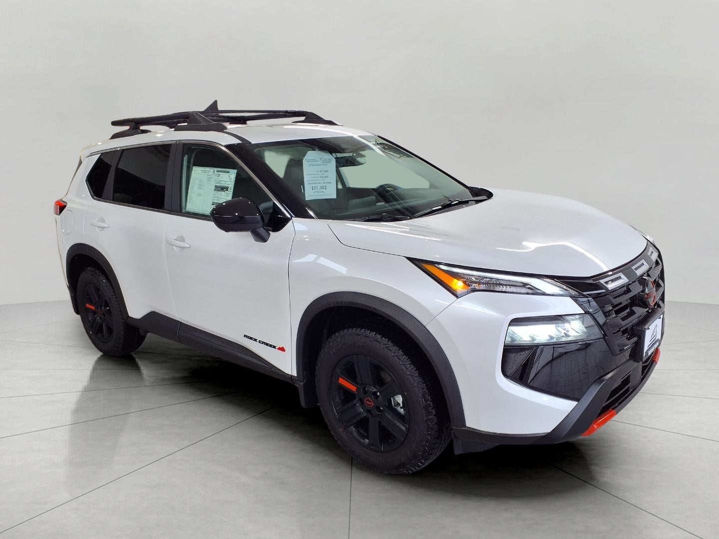 2026 Nissan Rogue 2026.5 AWD Rock Creek in Everest White Pearl Tricoat — front three-quarter view